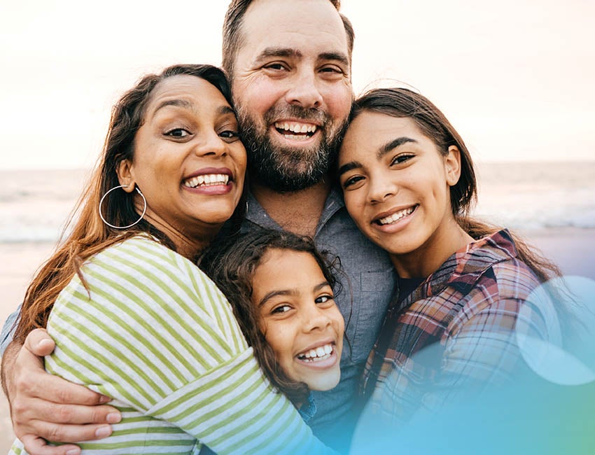 Happy family smiling at the camera